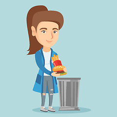Image showing Woman throwing out junk food into the trash can.