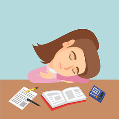 Image showing Young caucasian student sleeping on the desk.