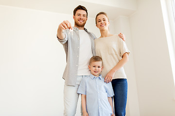 Image showing happy family with key moving to new home