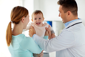 Image showing happy woman with baby and doctor at clinic