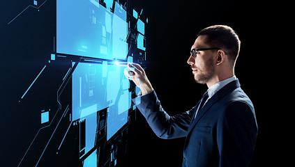 Image showing businessman working with virtual screen