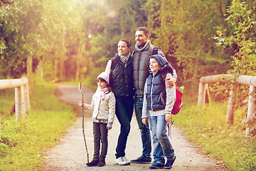 Image showing happy family with backpacks hiking