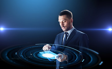 Image showing businessman in suit with transparent tablet pc