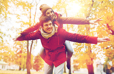 Image showing happy young couple having fun in autumn park