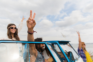 Image showing hippie friends at minivan car showing peace sign