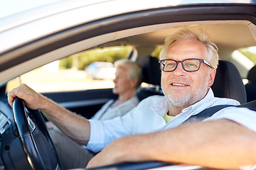 Image showing happy senior couple driving in car