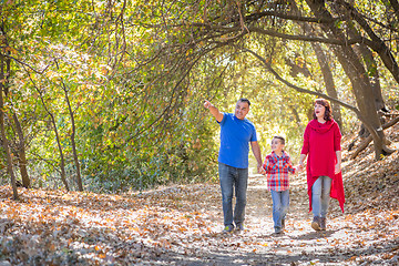 Image showing Mixed Race Caucasian and Hispanic Family Taking a Walk At The Pa