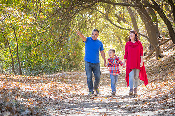 Image showing Mixed Race Caucasian and Hispanic Family Taking a Walk At The Pa