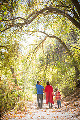 Image showing Mixed Race Caucasian and Hispanic Family Taking a Walk At The Pa