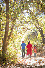 Image showing Mixed Race Caucasian and Hispanic Family Taking a Walk At The Pa