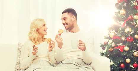 Image showing happy couple at home with christmas tree