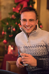 Image showing Happy young man with a glass of champagne