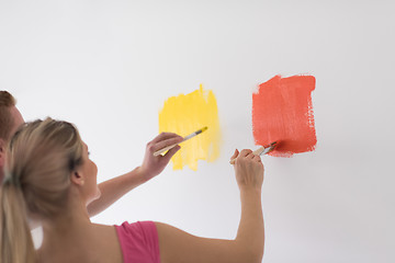 Image showing couple painting interior wall