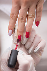 Image showing Woman hands receiving a manicure