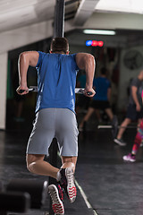 Image showing man doing exercises parallel bars