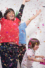 Image showing kids  blowing confetti