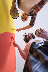 Image showing couple painting interior wall