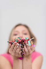 Image showing woman blowing confetti in the air