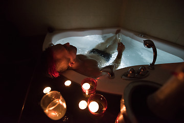 Image showing man relaxing in the jacuzzi