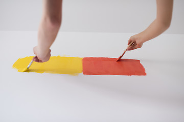 Image showing couple painting interior wall