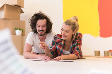 Image showing Happy young couple relaxing after painting