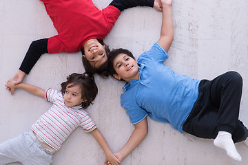 Image showing young boys having fun on the floor