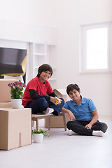 Image showing boys with cardboard boxes around them