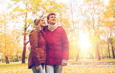 Image showing happy young couple walking in autumn park