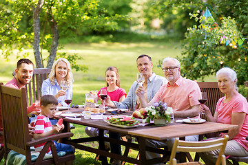 Image showing happy family having dinner or summer garden party