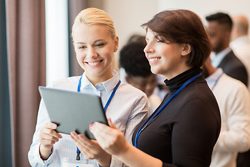 Image showing team with tablet pc at business conference