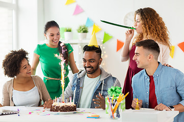 Image showing team greeting colleague at office birthday party