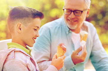 Image showing old man and boy eating ice cream at summer park