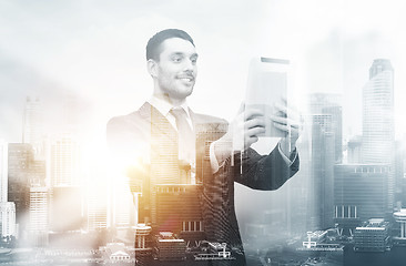 Image showing smiling businessman with tablet pc computer