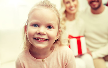 Image showing happy family at home with christmas gift box