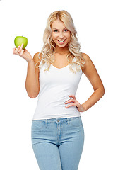 Image showing happy beautiful young woman with green apple