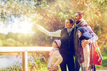 Image showing happy family with backpacks hiking