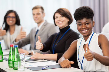 Image showing people at business conference showing thumbs up