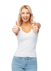 Image showing happy young woman showing thumbs up