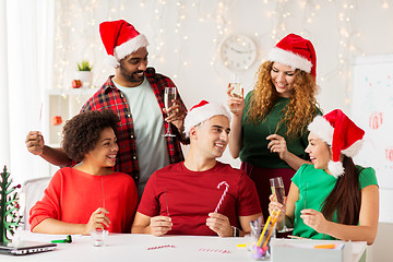 Image showing happy team celebrating christmas at office party