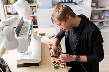 Image showing fashion designer with making dress at studio