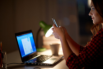 Image showing student woman with laptop and smartphone at home