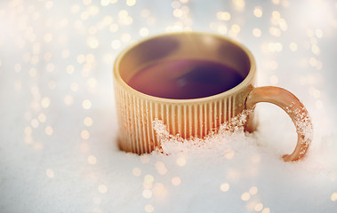 Image showing tea or coffee mug in snow