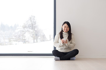 Image showing asian woman enjoying morning coffee