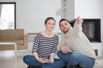 Image showing Young Couple using digital tablet on cold winter day