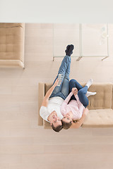 Image showing Young couple on the sofa watching television top view