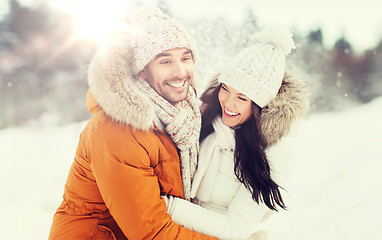 Image showing happy couple hugging and laughing in winter