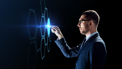 Image showing businessman working with virtual network hologram