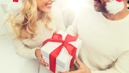 Image showing close up of couple with christmas gift at home