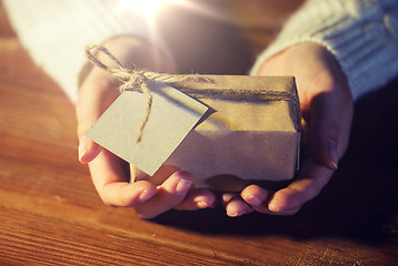 Image showing close up of woman with christmas gift or parcel