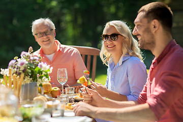 Image showing happy family having dinner or summer garden party